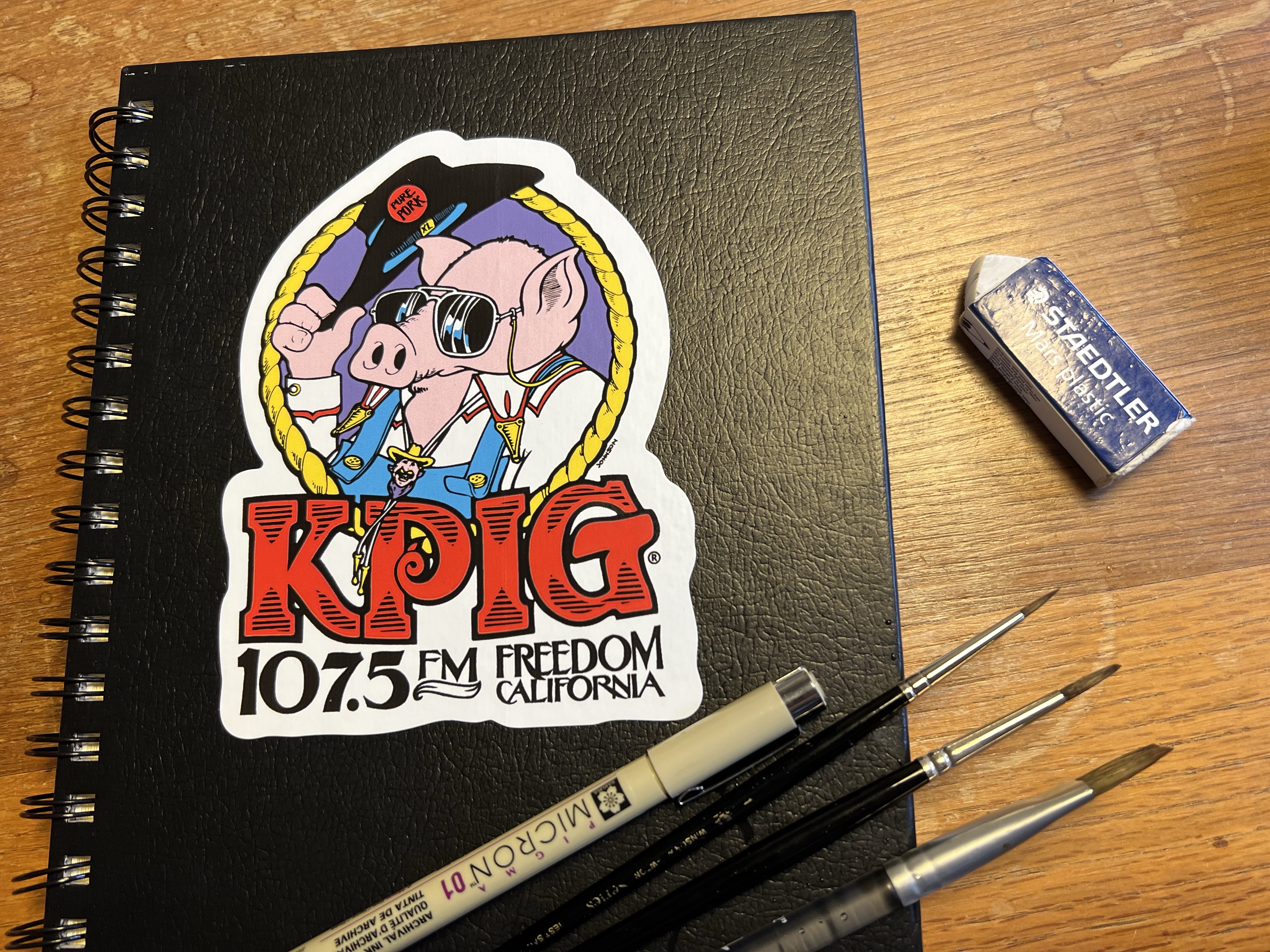 KPIG, 107 “oink” 5 FM – Corvid Sketcher